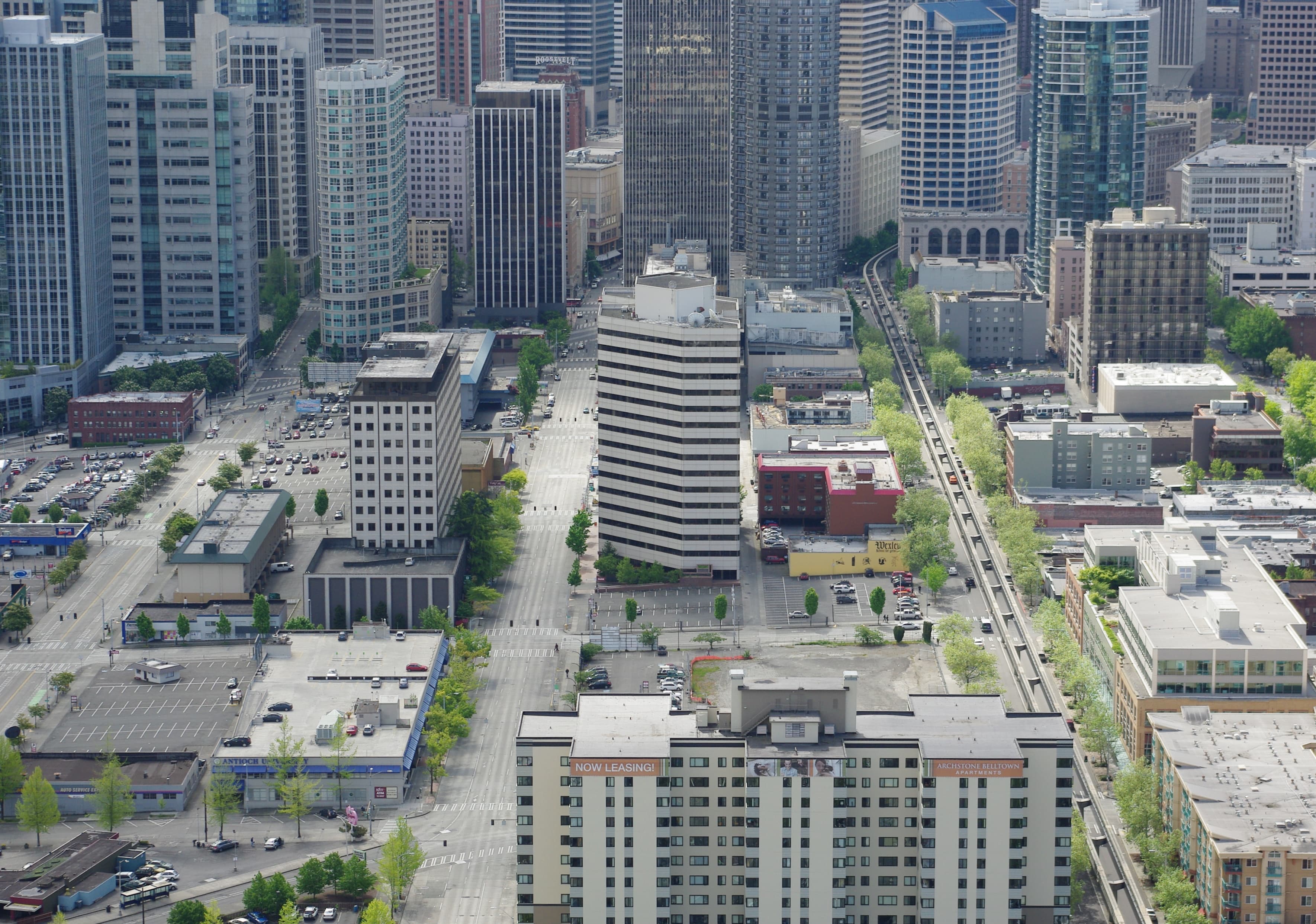 Aerial view of Belltown's high-rise condo towers with the Seattle Monorail running through the neighborhood